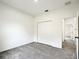 Spacious bedroom with gray carpet and double door closet at 13566 Sw 79Th Terrace Rd, Ocala, FL 34473
