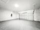 Spacious garage with white walls and gray flooring at 13566 Sw 79Th Terrace Rd, Ocala, FL 34473