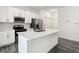 Kitchen island with white quartz countertop and sink at 13566 Sw 79Th Terrace Rd, Ocala, FL 34473