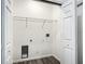 Laundry room with built-in shelving and white doors at 13566 Sw 79Th Terrace Rd, Ocala, FL 34473