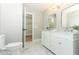 Updated bathroom with double vanity, marble floors, and walk-in closet at 1633 Cedar Glen Dr, Apopka, FL 32712