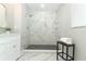 Modern bathroom with walk-in shower, marble tile, and white vanity at 1633 Cedar Glen Dr, Apopka, FL 32712