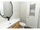 Updated bathroom with modern vanity, black faucet, and oval mirror at 1633 Cedar Glen Dr, Apopka, FL 32712