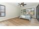 Spacious bedroom with hardwood floors and sliding glass doors at 1633 Cedar Glen Dr, Apopka, FL 32712