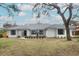 Updated home exterior boasts curb appeal with fresh landscaping at 1633 Cedar Glen Dr, Apopka, FL 32712