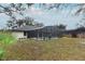 House back view, showcasing pool and backyard at 1633 Cedar Glen Dr, Apopka, FL 32712