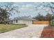 Front view of charming house with paver driveway at 1633 Cedar Glen Dr, Apopka, FL 32712