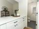 Modern white kitchen with white quartz countertops and black hardware at 1633 Cedar Glen Dr, Apopka, FL 32712