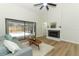 Living room with hardwood floors, fireplace, and sliding doors leading to the pool at 1633 Cedar Glen Dr, Apopka, FL 32712