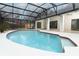 Relaxing kidney-shaped pool with screened enclosure and patio access at 1633 Cedar Glen Dr, Apopka, FL 32712