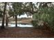 Peaceful waterfront view with lush vegetation, creating a serene atmosphere at 1633 Cedar Glen Dr, Apopka, FL 32712