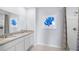 Double vanity bathroom with granite countertops and a walk-in shower at 1705 Frogmore Ave, Haines City, FL 33844