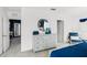 Spacious bedroom with dresser, seating, and access to a private bathroom at 1705 Frogmore Ave, Haines City, FL 33844