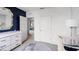 Bedroom with crib, changing table and access to another room at 1705 Frogmore Ave, Haines City, FL 33844