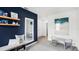 Playroom with navy accent wall, two ' tables, and plenty of storage at 1705 Frogmore Ave, Haines City, FL 33844