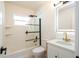 Bright bathroom with sleek black fixtures, glass shower door, and modern vanity at 2002 Geigel Ave, Orlando, FL 32806
