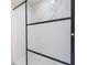 Modern bathroom shower with white tile and sleek glass door at 2002 Geigel Ave, Orlando, FL 32806