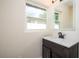 Bathroom featuring a dark vanity with stone countertop and modern faucet at 2002 Geigel Ave, Orlando, FL 32806