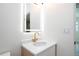 Modern bathroom vanity with gold faucet, LED mirror, and quartz countertop adds elegance at 2002 Geigel Ave, Orlando, FL 32806