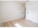 Bright bedroom with light wood flooring and freshly painted white walls at 2002 Geigel Ave, Orlando, FL 32806