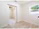 Bright bedroom featuring sliding barn door and laminate wood flooring at 2002 Geigel Ave, Orlando, FL 32806