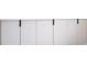 Close up of bedroom built-in cabinets with minimalist black hardware at 2002 Geigel Ave, Orlando, FL 32806