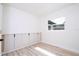 Bright bedroom with wood floors, built-in cabinets and a large window at 2002 Geigel Ave, Orlando, FL 32806