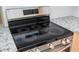 Stainless steel electric cooktop with glass top and digital controls provides modern convenience and style at 2002 Geigel Ave, Orlando, FL 32806