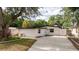 Beautiful home with an inviting exterior, a fresh color palette, and a spacious driveway at 2002 Geigel Ave, Orlando, FL 32806