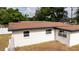 A high angle view of a one story white building with two windows and a brown roof at 2002 Geigel Ave, Orlando, FL 32806