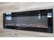 Close-up of the black, wall-mounted electric fireplace with modern design and simulated flames at 2002 Geigel Ave, Orlando, FL 32806