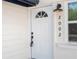 Inviting front entrance with bright white door, modern black hardware, and clear house number at 2002 Geigel Ave, Orlando, FL 32806