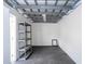 Clean garage with ample room, storage shelves, and painted floors for easy clean-up at 2002 Geigel Ave, Orlando, FL 32806