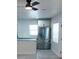 Bright kitchen with stainless steel refrigerator and modern ceiling fan at 2002 Geigel Ave, Orlando, FL 32806