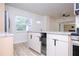 Bright kitchen featuring white cabinets, modern appliances, and an island with bar seating at 2002 Geigel Ave, Orlando, FL 32806