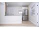 Well-lit kitchen featuring stainless steel refrigerator and a breakfast bar at 2002 Geigel Ave, Orlando, FL 32806