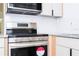 Kitchen featuring stainless steel appliances, granite countertops, and white tile backsplash at 2002 Geigel Ave, Orlando, FL 32806