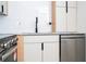 Updated kitchen featuring stainless steel appliances, light wood accents, and white cabinetry at 2002 Geigel Ave, Orlando, FL 32806