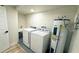 Laundry area with washer, dryer, and water heater at 2002 Geigel Ave, Orlando, FL 32806