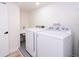 Laundry room features modern washer, dryer, and utility sink at 2002 Geigel Ave, Orlando, FL 32806