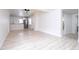 Bright and airy living room with light floors and view to modern kitchen at 2002 Geigel Ave, Orlando, FL 32806