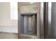 Close-up of a stainless steel refrigerator featuring a water and ice dispenser with modern control panel at 2002 Geigel Ave, Orlando, FL 32806