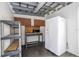 Shed featuring a microwave, workspace, and white refrigerator at 2002 Geigel Ave, Orlando, FL 32806