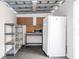 Shed interior complete with microwave, workspace, and a white refrigerator at 2002 Geigel Ave, Orlando, FL 32806