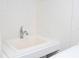 Close-up of utility sink with faucet in a clean, well-lit utility room at 2002 Geigel Ave, Orlando, FL 32806