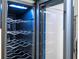 Modern wine fridge featuring sleek design with temperature control and interior lighting at 2002 Geigel Ave, Orlando, FL 32806