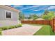 Large backyard features a brick patio, privacy fence, and lush green grass at 219 Laurel Ave, Sanford, FL 32771