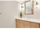 Stylish bathroom features a modern vanity with a sleek countertop, contemporary fixtures, and decorative lighting at 219 Laurel Ave, Sanford, FL 32771