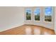 Bright bedroom with hardwood floors, featuring natural light and scenic views at 219 Laurel Ave, Sanford, FL 32771