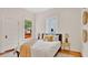 Comfortable bedroom with a bed, side tables, and a window that provides plenty of natural light at 219 Laurel Ave, Sanford, FL 32771